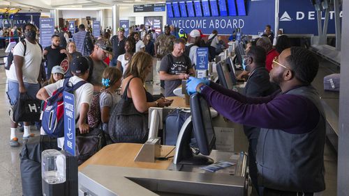 Passengers check in for Delta flights in the domestic terminal of Hartsfield-Jackson Atlanta International Airport on Wednesday, June 29, 2022. (Chris Day/Christopher.Day@ajc.com)