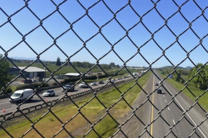 This image provided by KEZI 9 News shows traffic on Interstate 5 on Tuesday, April 23, 2024, near Eugene, Ore., after a former Washington state police officer wanted after killing two people, including his ex-wife, was found with a self-inflicted gunshot wound following a chase in Oregon, authorities said. His 1-year-old baby, who was with him, was taken safely into custody by Oregon State Police troopers. (KEZI 9 News via AP)