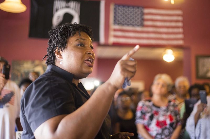 Georgia Democratic gubernatorial candidate Stacey Abrams speaks to a crowd gathered at Nabila’s Graden restaurant in Fitzgerald,  in August. Addressing her financial debts, Abrams says that it’s evidence that “I have lived a real life.” (ALYSSA POINTER/ALYSSA.POINTER@AJC.COM)