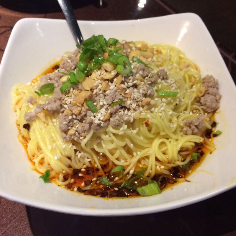 Yummy Spicy’s dan dan noodles — vermicelli in spicy broth with choice of ground pork or beef, garnished with scallions, sesame seeds, and chopped peanuts — make a great complement to any meal. CONTRIBUTED BY WENDELL BROCK
