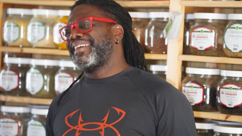 Chef Matthew Raiford explains the history of Gilliard Farms in the food lab he shares with his partner, herbalist Javon Sage. Wild-grown organic botanical-filled jars line the shelves. CONTRIBUTED BY SANJEEV AND UMA CHATTERJEE