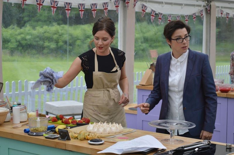 Eventual “Great British Baking Show” winner Candice Brown chats at her workstation with co-host Sue Perkins. (Courtesy of BBC)