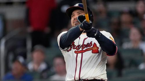 Atlanta Braves' Travis d'Arnaud watches a two-run home run in the fourth inning of a baseball game against the Miami Marlins Monday, April 22, 2024, in Atlanta. (AP Photo/John Bazemore)