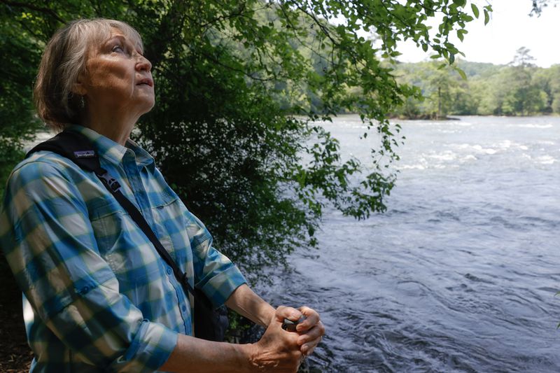 Now retired from Chattahoochee Riverkeeper, Sally Bethea enjoys the views of the river after hiking along East Palisades trail in Sandy Springs. (Natrice Miller/ natrice.miller@ajc.com)