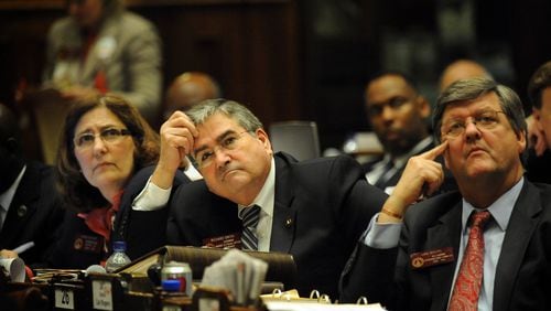 The death of state House Rules Chairman Richard Smith (center), was announced Tuesday at the Georgia Capitol. First elected as a state representative from Columbus in 2004, Smith, died from the flu. HYOSUB SHIN / HSHIN@AJC.COM