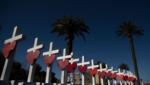 Fifty-eight white crosses for the victims of Sunday night's mass shooting stand on the south end of the Las Vegas Strip. They were built by Greg Zanis, a retired carpenter from the Chicago suburbs.