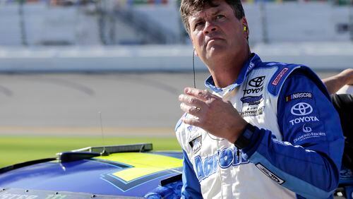 Michael Waltrip scans the leader board after his Sunday qualifying run for the Daytona 500. He was not terribly pleased, putting up the 35th fastest time. (AP Photo/Terry Renna)