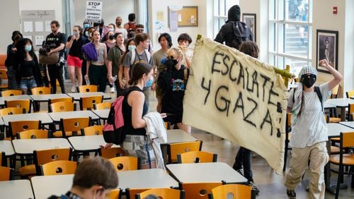 Protesters at Emory marched into Cox Hall near the quad during demonstrations Friday.