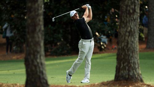 Rory McIlroy's swing is just about a work of art as he finishes off his first round at the Masters Thursday. (Andrew Redington/Getty Images)