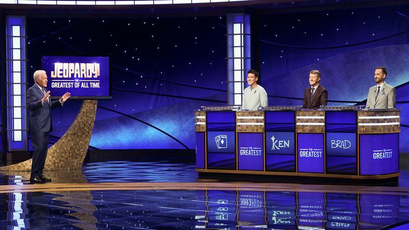 In this image released by ABC, host Alex Trebec, left, appear with contestants, James Holzhauer, center, Ken Jennings and Brad Rutter, right, on the set of "Jeopardy! The Greatest of All Time," in Los Angeles. The all-time top Jeopardy! money winners; Rutter, Jennings and  Holzhauer, will compete in a rare prime-time edition of the TV quiz show which will air on consecutive nights beginning 8 p.m. EDT Tuesday. (Eric McCandless/ABC via AP)