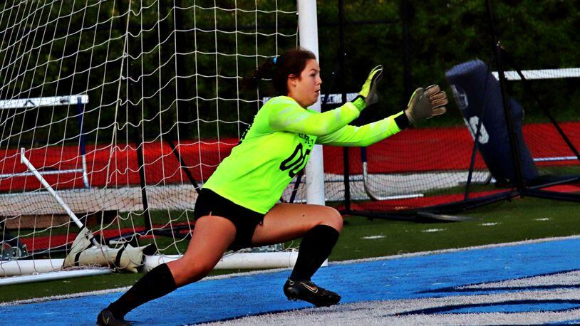 Chamblee goalkeeper Mary Entreckin moves over to deny a shot during Chamblee’s 6-3 victory over Cambridge in the Class 5A girls quarterfinals at Cambridge. Entrekin had nine saves in the match.