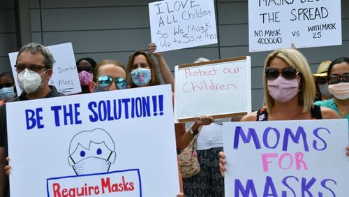 Cobb County schools remain mask-optional. Parents held a rally at the start of the school year in August to encourage the district to require masks. (Hyosub Shin / Hyosub.Shin@ajc.com)