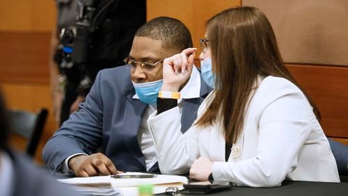 Nicole Fegan talks with her client, Tenquarius Mender, during the Young Slime Life gang trial. On Feb. 14, prosecutors filed a motion to sever the trial of Mender from that of the other YSL co-defendants after Fegan made the court aware of her imminent personal leave of absence due to pregnancy. (Miguel Martinez / miguel.martinezjimenez@ajc.com)
