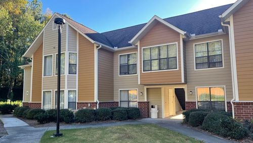 An extended-stay hotel at the entrance to Technology Park in Peachtree Corners will become an apartment complex. (Tyler Wilkins / tyler.wilkins@ajc.com)