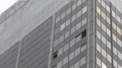 Debris fell Tuesday for a third straight day from the 32-story building. (Credit: Channel 2 Action News)