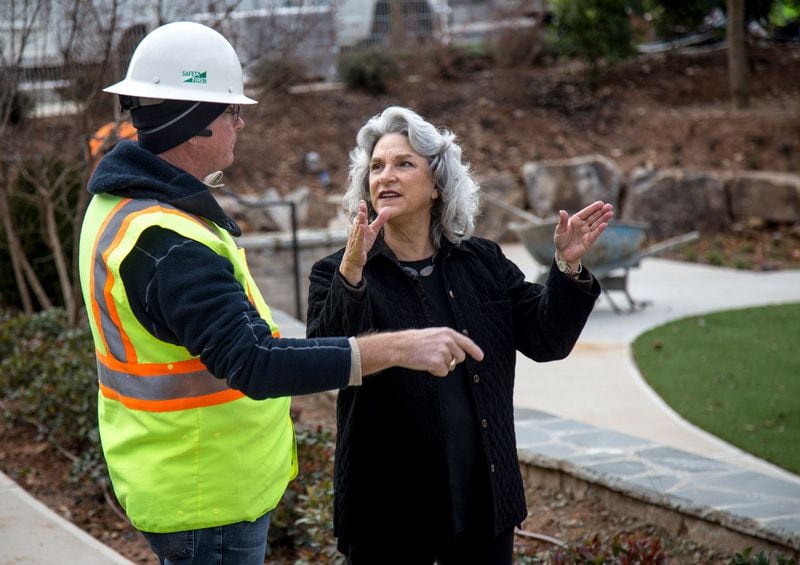 Cheri Morris (right) speaks with construction superintendent Scott Thompson at the new Alpharetta City Center earlier this month. STEVE SCHAEFER / SPECIAL TO THE AJC