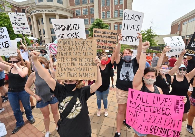 Hundreds attended a peaceful rally Saturday outside the Forsyth County courthouse. (Photo: Hyosub Shin/AJC)