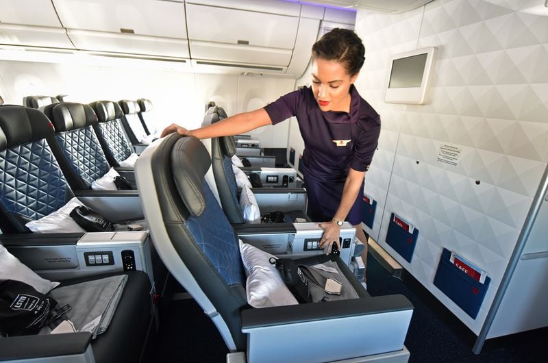 Flight attendant Danette Coombs shows off the Airbus A350's Delta Premium Select suite during a media event at Hartsfield-Jackson International Airport on Tuesday, October 17, 2017. HYOSUB SHIN / HSHIN@AJC.COM