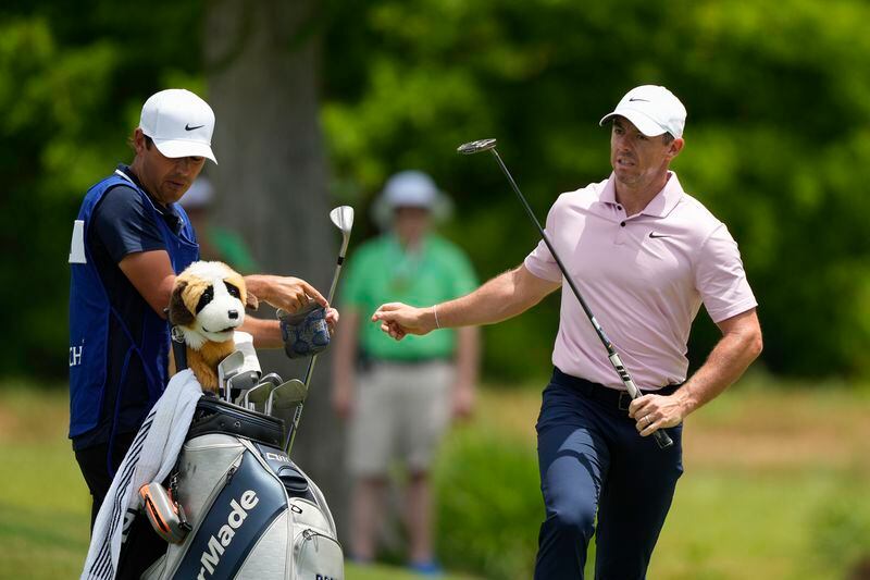 Rory McIlroy, of Northern Ireland, changes clubs on the second green during the first round of the PGA Zurich Classic golf tournament at TPC Louisiana in Avondale, La., Thursday, April 25, 2024. (AP Photo/Gerald Herbert)