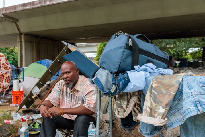 Thomas Lecky, 41, speaks to a reporter at a homeless encampment in downtown Atlanta on Thursday, August 25, 2022. The city and the nonprofit Partners for HOME plan to shut down the encampment before Labor Day and find housing for the residents. (Arvin Temkar / arvin.temkar@ajc.com)