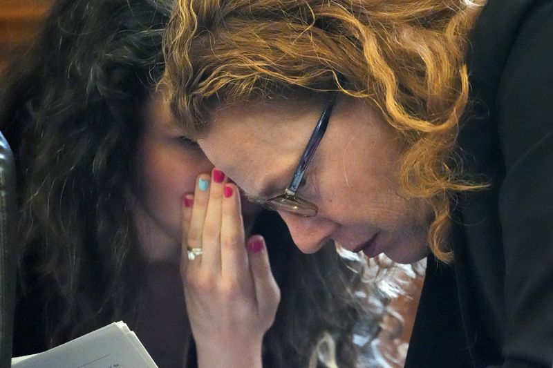 Nashville Law Department Associate Director attorney Lora Barkenbus Fox, right, confers with a colleague during a hearing to decide whether the journals of the Covenant School shooter can be released to the public Tuesday, April 16, 2024, in Nashville, Tenn. (AP Photo/George Walker IV)