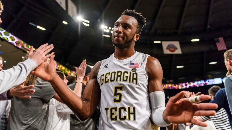 Georgia Tech guard Josh Okogie (5) celebrates with fans after defeating North Carolina State in an NCAA college basketball game, in Atlanta, Thursday, March 1, 2018. (AP Photo/Danny Karnik)