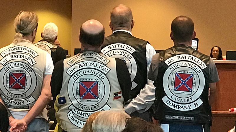 Members of the Sons of Confederate Veterans at the commission meeting Tuesday. Commissioner Dee Clemmons, the object of their ire, is at right. (Rosalind Bentley / rbentley@ajc.com)