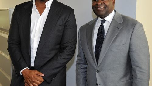Atlanta Mayor Kasim Reed and filmmaker Tyler Perry at the meeting announcing Perry's purchase of 330 acres at the former Fort McPherson Army base on Aug. 8, 2014. AJC file photo: David Tulis