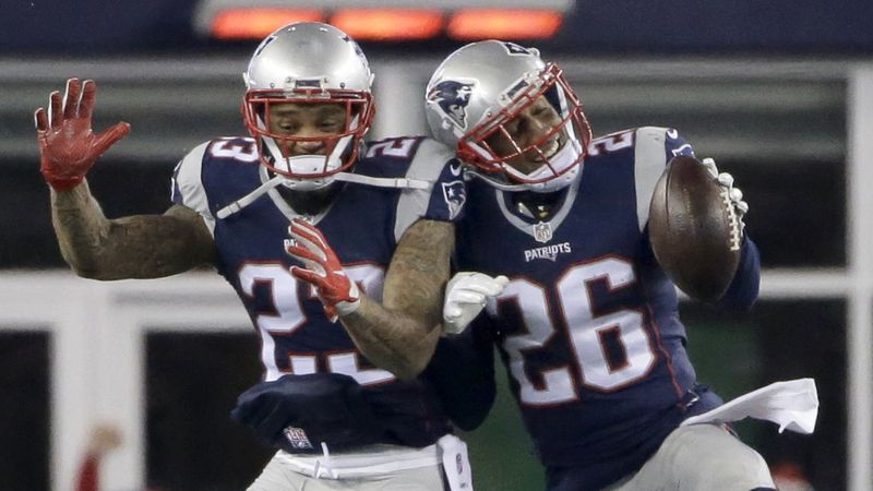 New England Patriots cornerback Logan Ryan (26) celebrates his interception with Patrick Chung during the second half of the NFL Divisional Playoff game against the Houston Texans.