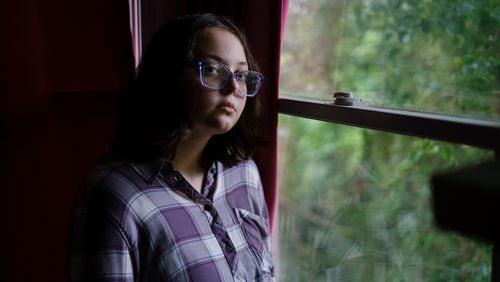 Latha Wright, a 16-year-old Atlanta student, says mental health is misunderstood. “For some reason, you’re allowed to miss school if you’re physically sick,” she said. “But if you’re super depressed or if you had a really bad anxiety attack the night before … it’s not excused.” She posed for a portrait at her home on May 25, 2022. (Arvin Temkar / arvin.temkar@ajc.com)