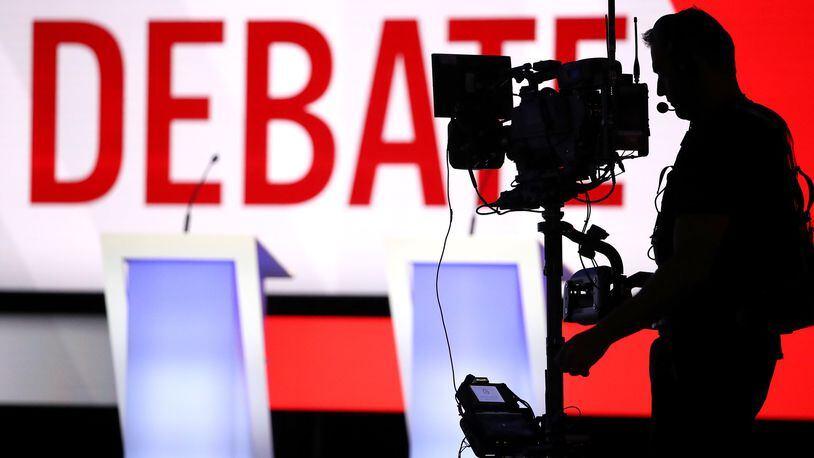 A camera operator works in front of the stage before Tuesday’s Democratic presidential debate at Otterbein University in Westerville, Ohio. The next debate is scheduled for Nov. 20 in Georgia. A location has yet to be selected, although the event is expected to be held in metro Atlanta. (Photo by Win McNamee/Getty Images)