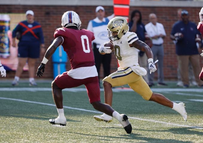  Georgia Tech Yellow Jackets running back Trey Cooley (0) evades South Carolina State Bulldogs defensive back Malcolm Magee (0) to score a touchdown in the second half during a football game against South Carolina State at Bobby Dodd Stadium in Atlanta on Saturday, September 9, 2023.   (Bob Andres for the Atlanta Journal Constitution)