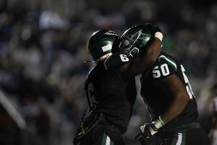Collins Hill's Spenser Anderson (6) and Cedric Richardson (50) celebrate during a GHSA high school football game between the Collins Hill Eagles and the Grayson Rams at Collins Hill High in Suwanee, GA., on Friday, December 3, 2021. (Photo/ Jenn Finch)