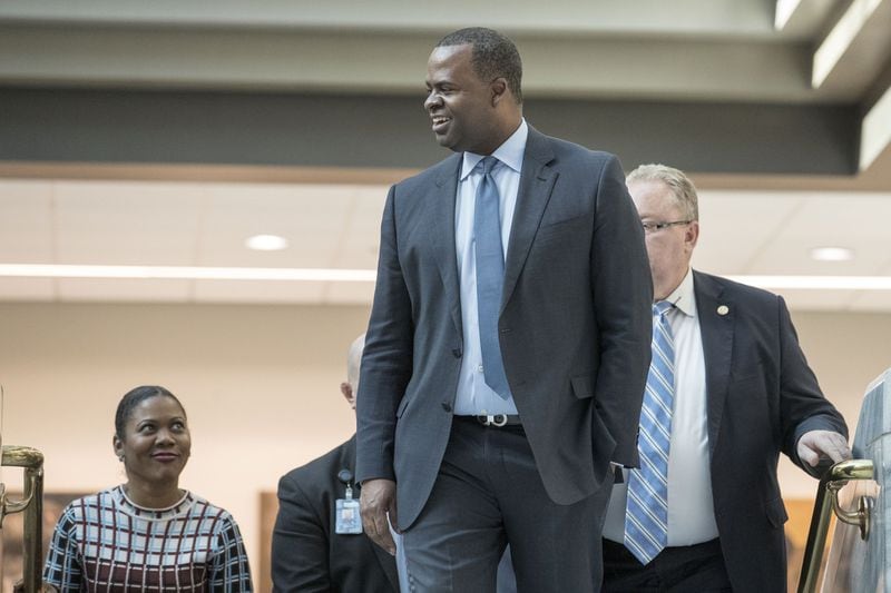 Atlanta mayor Kasim Reed smiles as people gathered in the atrium of Atlanta City Hall applaud him during his final workday as mayor of in December 2017. Since 2015, Reed has repaid taxpayers more than $50,000 charged to his city-issued credit card. ALYSSA POINTER / ALYSSA.POINTER@AJC.COM