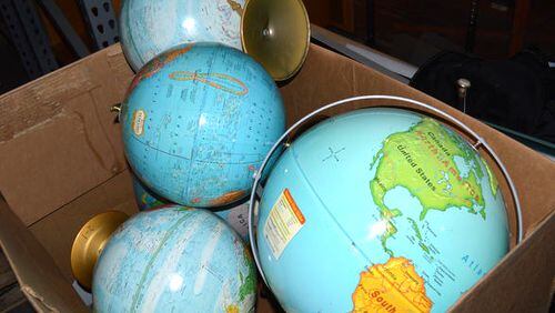 A bin of classroom globes are among the items the Cherokee County Schools plan to sell at auction Nov. 5. JEFF DOBSON & ASSOCIATES