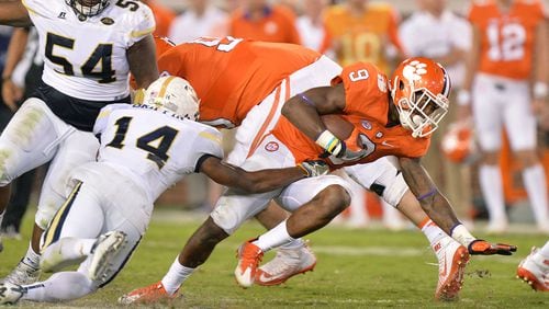 Clemson Tigers running back Wayne Gallman (9) eludes a tackle by Georgia Tech defensive back Corey Griffin (14) in the second half at Bobby Dodd Stadium on Thursday, September 22, 2016. Clemson Tigers won 26 - 7.
