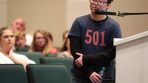Kino Ciel Stanfield, 20,a 2017 Pickens High graduate who started his transition after graduation, speaks during a school board meeting Monday to address transgender students’ use of school bathrooms. CURTIS COMPTON/CCOMPTON@AJC.COM