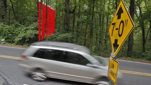 June 20, 2019 - Smyrna - Cobb County’s covered bridge gets a second warning device to stop drivers from running into the historic covered bridge on Concord Road. Bob Andres / bandres@ajc.com