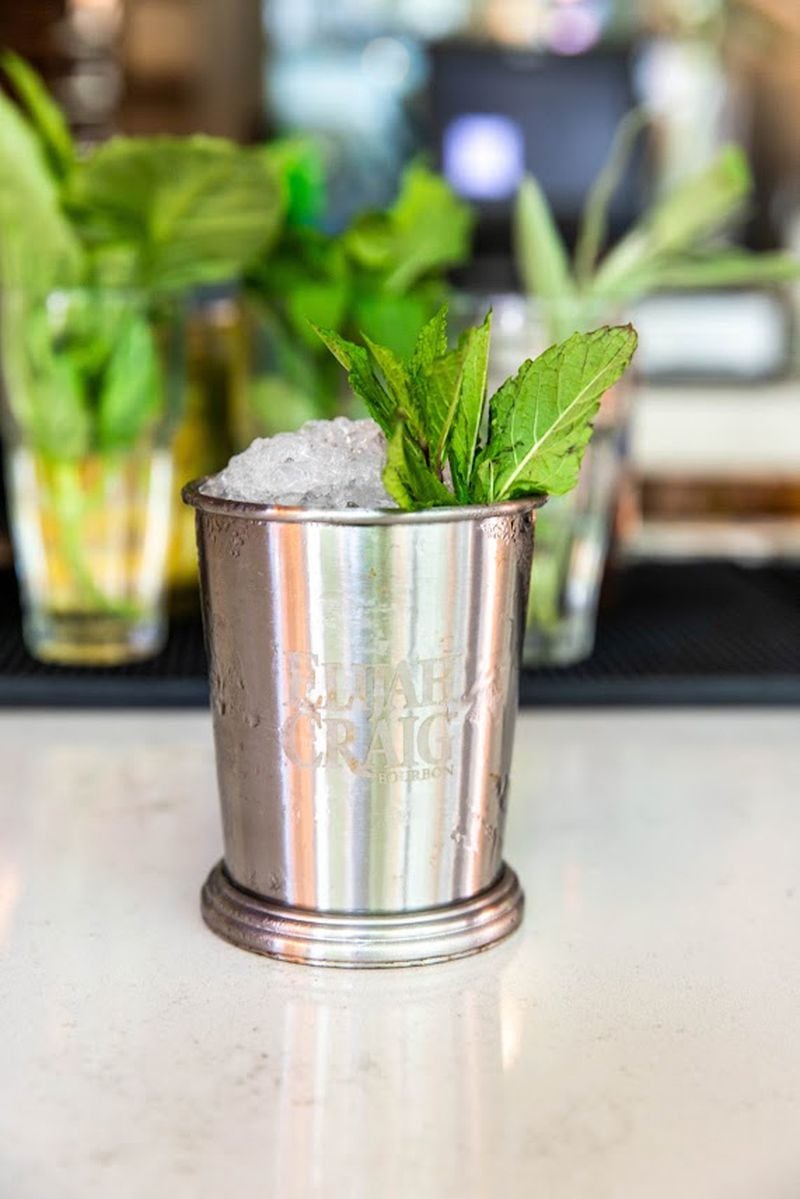 Traditionally, a mint julep is offered in a silver cup topped with mint julep as served at the Hampton + Hudson Kentucky Derby Party. 
Courtesy of Hampton + Hudson.