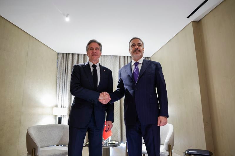 U.S. Secretary of State Antony Blinken, left, shakes hands with Turkey's Foreign Minister Hakan Fidan on the day of the World Economic Forum (WEF) in Riyadh, Saudi Arabia, Monday April 29, 2024. (Evelyn Hockstein/Pool via AP)