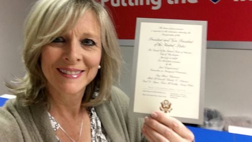Rosalie Parkey of Alpharetta holds up her ticket to the Trump inauguration. She says this is a “bucket list” event in her life. (Image courtesy of Rosalie Parkey)