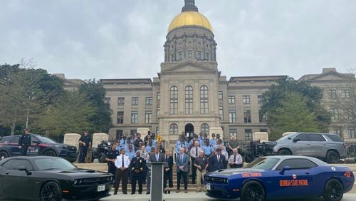 Gov. Brian Kemp (center) praised the work of the state's multi-agency Crime Suppression Unit in through its first year of operation.