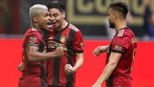 Atlanta United’s Josef Martinez (left) reacts after scoring a goal against Toronto FC.