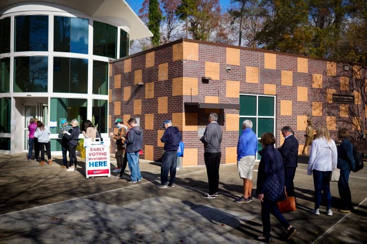 Fulton county residents take advantage of early voting Monday morning in Atlanta. Lines stretched out the door at the Northside branch library on Monday, Nov. 28, 2022.  (Ben Hendren for the Atlanta Journal Constitution) 