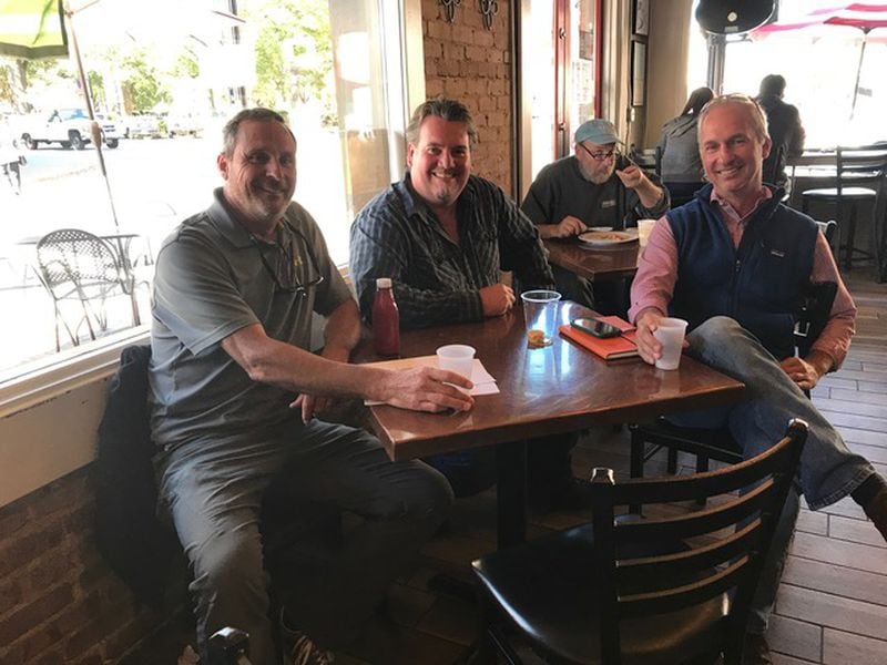 Glover Park Brewery owners Sam Rambo, left, and Hank DuPre, far right, sit on either side of Kevin McNerney, co-founder of SweetWater Brewing and a beer adviser to the new Marietta brewery. (Provided by Glover Park Brewery)
