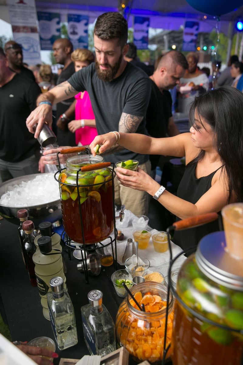 Pictured is a 2018 image of employees of Nam Kitchen who made the cocktail the Nam Mule for guests at the Food That Rocks event. PHOTO / JASON GETZ