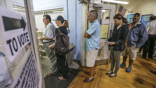 Voters line up on Tuesday, June 20, 2017, at the Hammond Park Gymnasium, as 6th District voters choose whether to send Republican Karen Handel or Democrat Jon Ossoff to Washington. JOHN SPINK/JSPINK@AJC.COM.