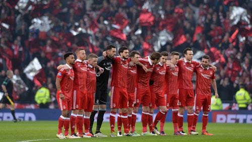 The Aberdeen team lines up during the Betfred Cup Final between Aberdeen FC and Celtic FC at Hampden Park on November 27, 2016 in Glasgow, Scotland.