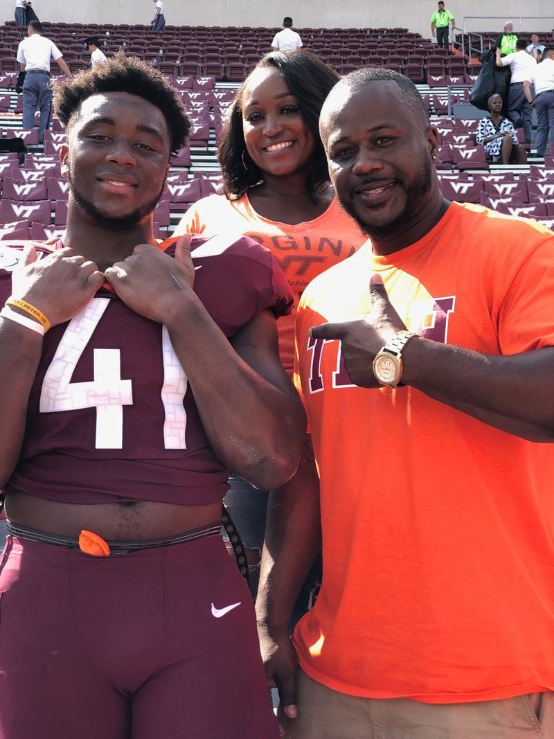 Virginia Tech defensive end Jaylen Griffin with his parents Tyrone and LaBretha at a Hokies game. (Photo courtesy Tyrone Griffin)