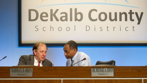 DeKalb County Board of Education members Marshall Orson (left) and Michael A. Erwin (right) talk during a special meeting Monday, Nov. 11, 2019. The board voted 6-1 to cut ties with Superintendent Steve Green. Ramona Tyson, Green’s former chief of staff and a former interim superintendent who now reports directly to the school board, is now the district’s interim leader. ALYSSA POINTER/ATLANTA JOURNAL CONSTITUTION